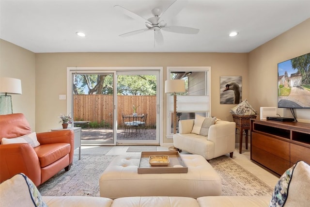 tiled living room featuring ceiling fan