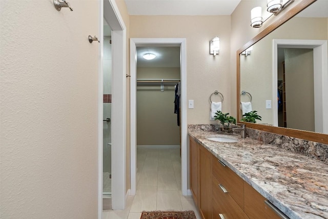 bathroom with vanity and tile patterned floors