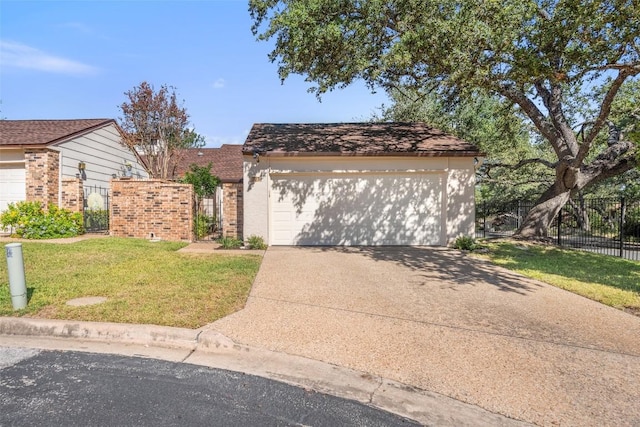 view of front of property featuring a garage and a front lawn