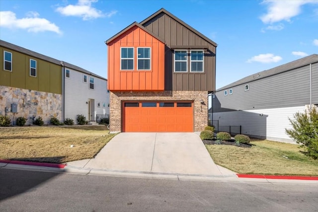 view of front of house featuring a garage and a front yard