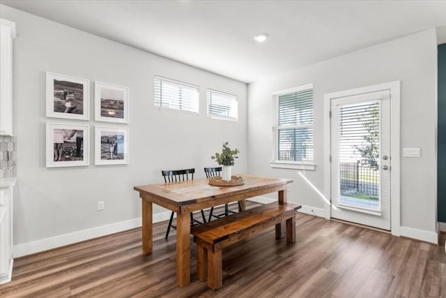 dining area with wood-type flooring