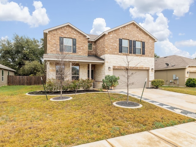 view of front of house with a garage and a front lawn