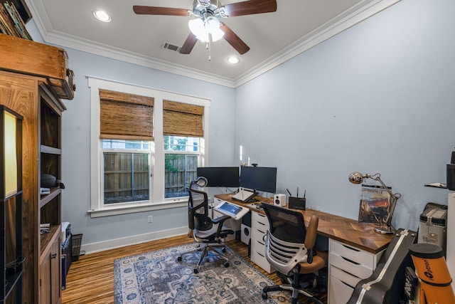 office area featuring dark hardwood / wood-style flooring, crown molding, and ceiling fan