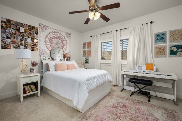 bedroom featuring ceiling fan and light carpet