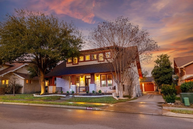 view of front of property with covered porch and stone siding