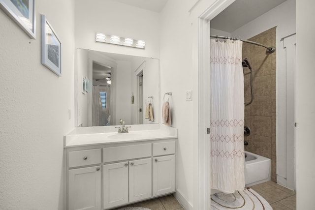 bathroom featuring shower / tub combo with curtain, vanity, tile patterned floors, and ceiling fan