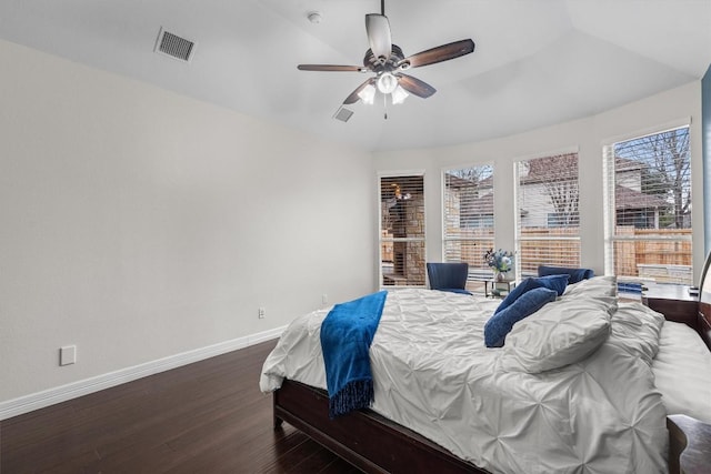 bedroom with dark hardwood / wood-style flooring and ceiling fan