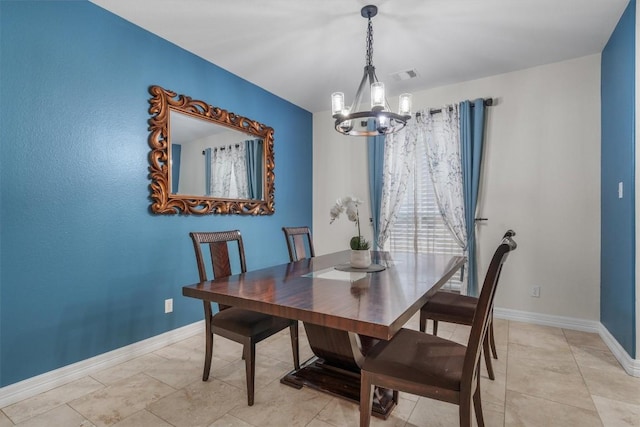 dining area with visible vents, baseboards, and a notable chandelier