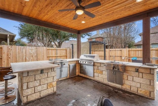 view of patio / terrace with grilling area, area for grilling, ceiling fan, and fence