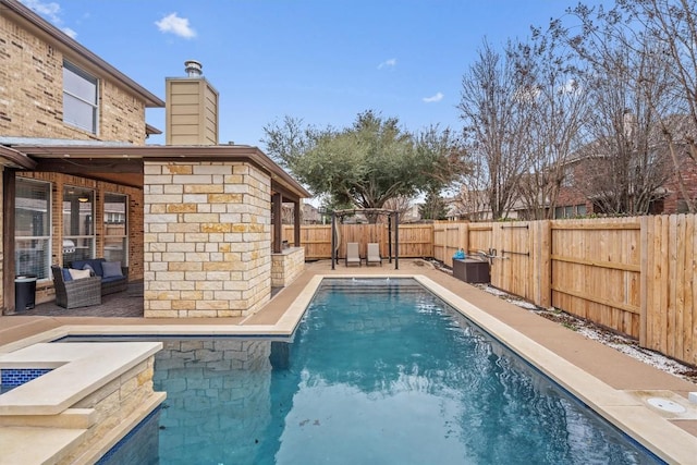 view of swimming pool with a fenced in pool, a fenced backyard, outdoor lounge area, and a patio area