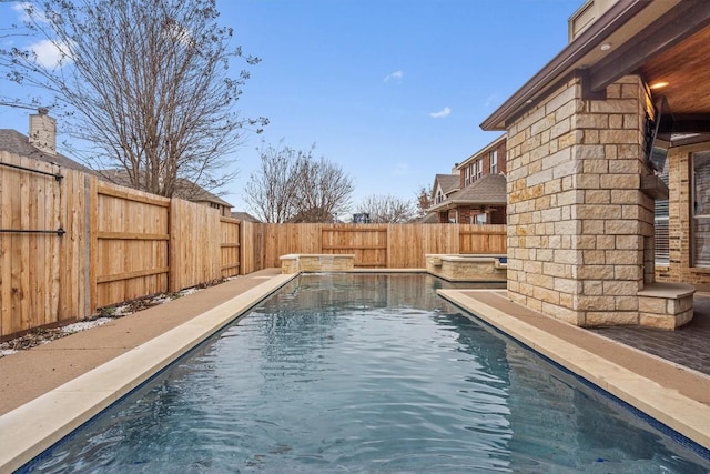 view of pool with a fenced in pool and a fenced backyard