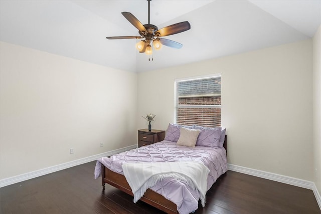 bedroom with a ceiling fan, lofted ceiling, wood finished floors, and baseboards