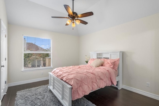 bedroom featuring lofted ceiling, dark hardwood / wood-style floors, and ceiling fan