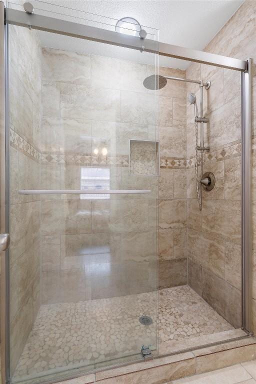 bathroom with an enclosed shower