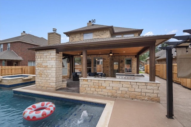 rear view of property with area for grilling, a ceiling fan, a patio, and fence