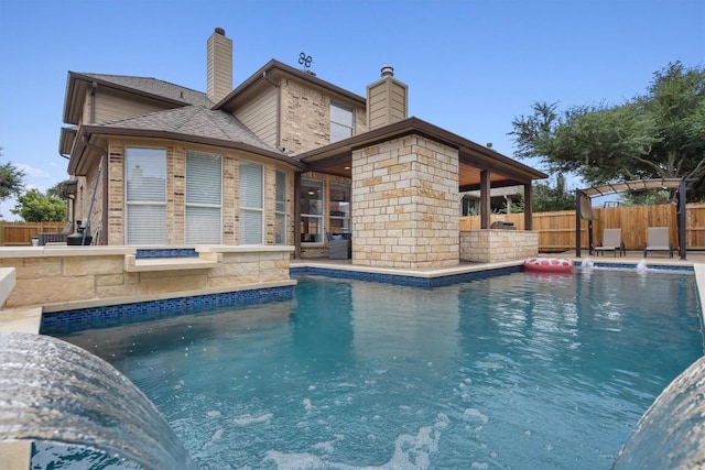 view of pool featuring a patio area, fence, and a fenced in pool