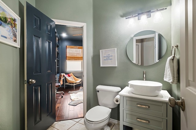 bathroom with vanity, tile patterned floors, and toilet