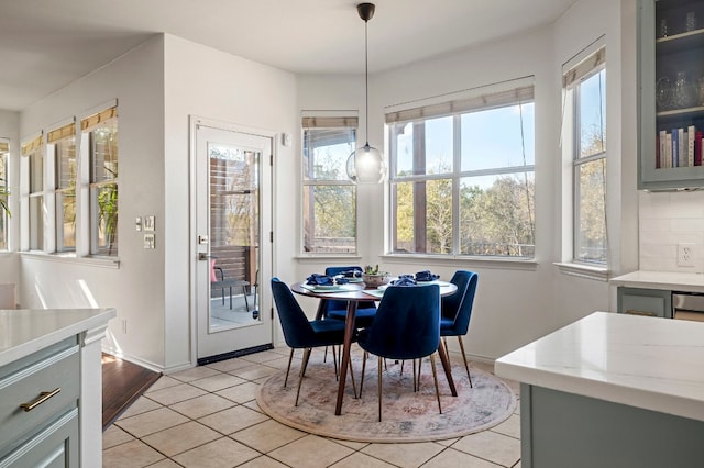 dining space featuring light tile patterned flooring