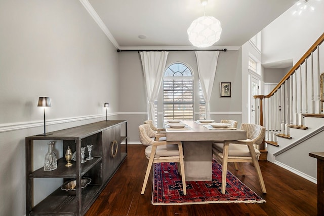 dining room featuring crown molding and dark wood-type flooring