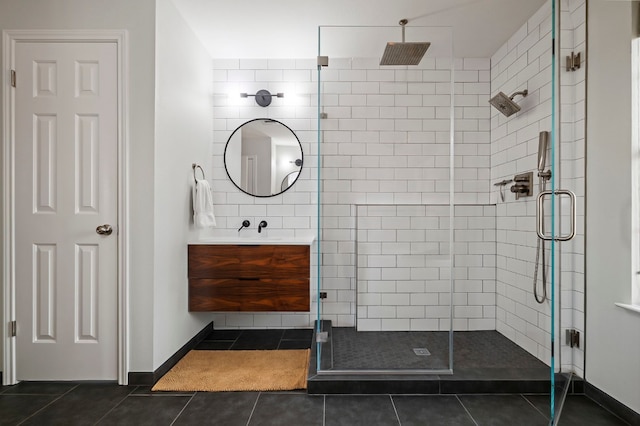 bathroom with tile patterned flooring, vanity, and a shower with shower door