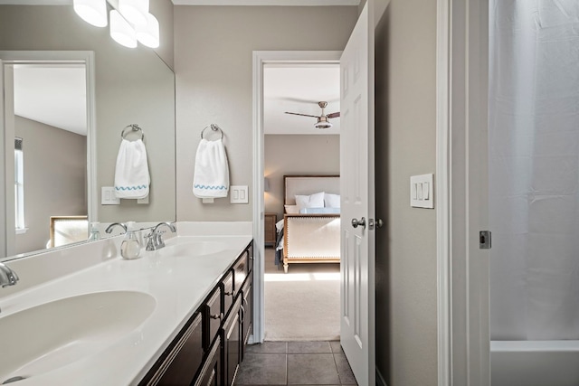 bathroom featuring tile patterned flooring and vanity