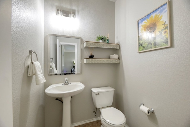 bathroom featuring sink and toilet