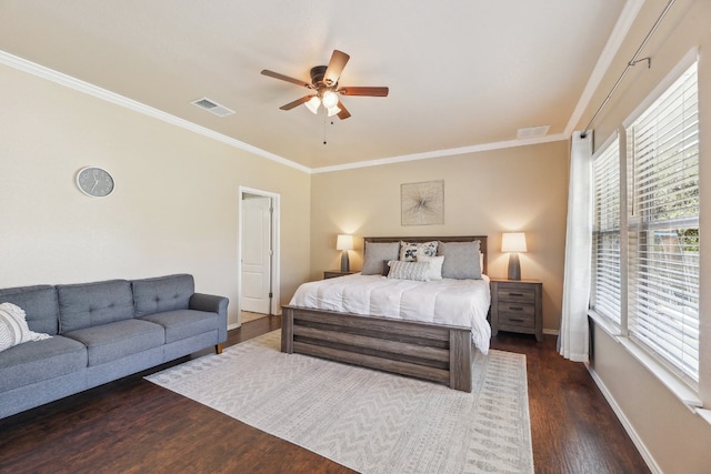 bedroom featuring ceiling fan, ornamental molding, and dark hardwood / wood-style floors