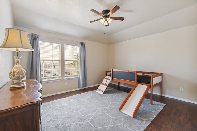 bedroom with ceiling fan and dark hardwood / wood-style floors