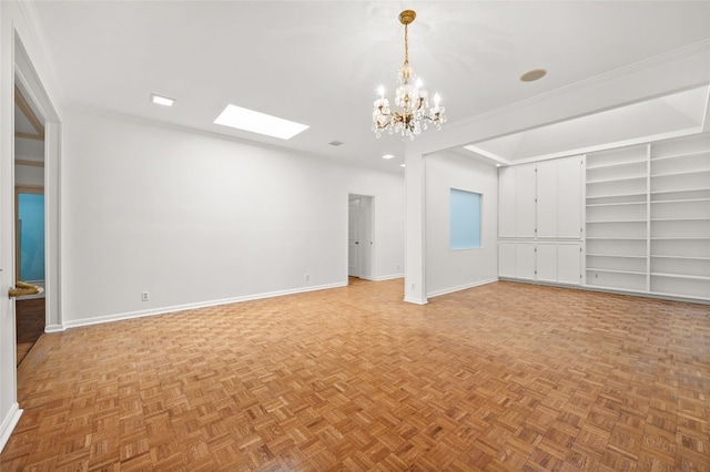 unfurnished room with crown molding, a skylight, built in shelves, and light parquet floors