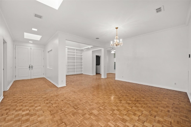 unfurnished living room featuring light parquet floors, ornamental molding, an inviting chandelier, and a skylight