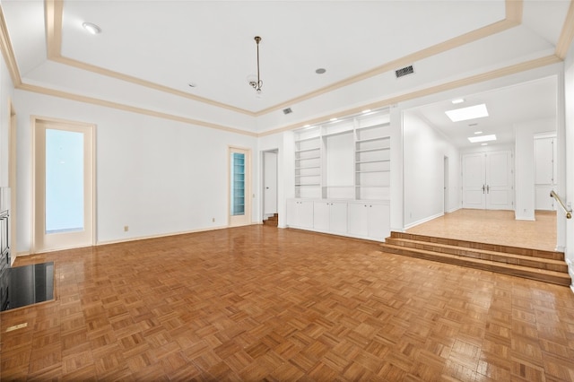 unfurnished living room with a raised ceiling, crown molding, and parquet floors