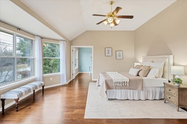 bedroom with hardwood / wood-style floors and vaulted ceiling