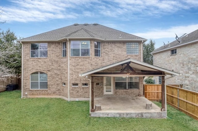 rear view of property with cooling unit, a lawn, and a patio