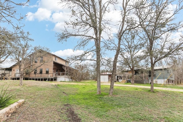 view of yard featuring a deck