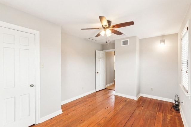 unfurnished bedroom with wood-type flooring and ceiling fan