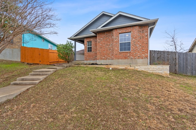 back of house with a yard