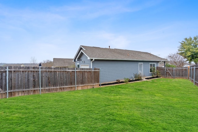 view of yard featuring a fenced backyard