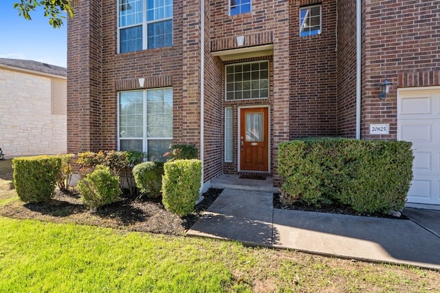 property entrance with a garage