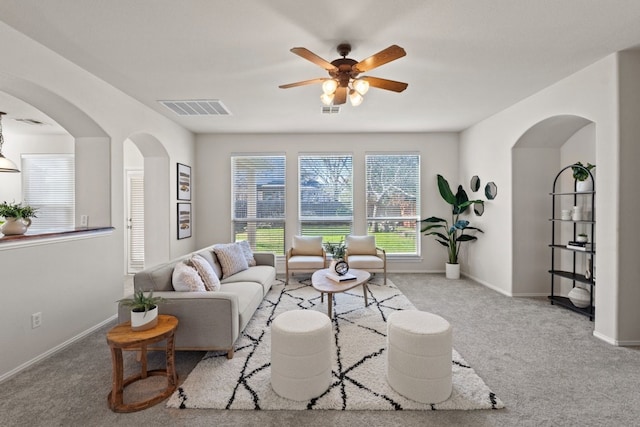 living room with light colored carpet and ceiling fan