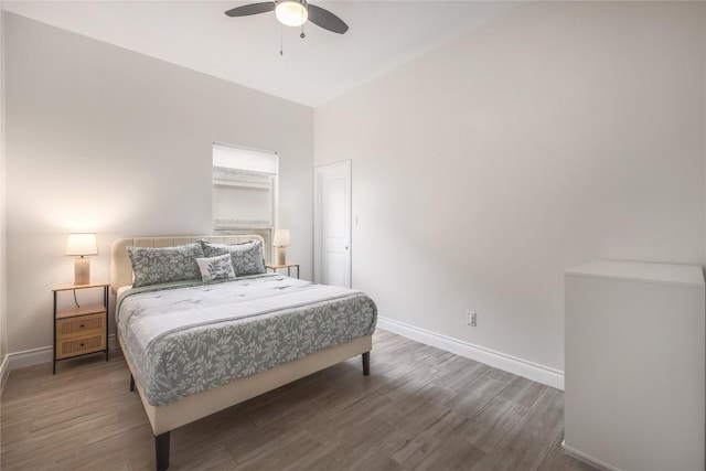 bedroom with dark wood-type flooring and ceiling fan