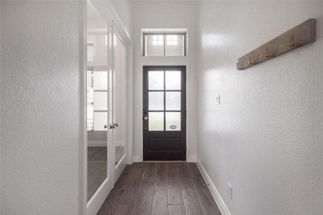 doorway with dark hardwood / wood-style flooring