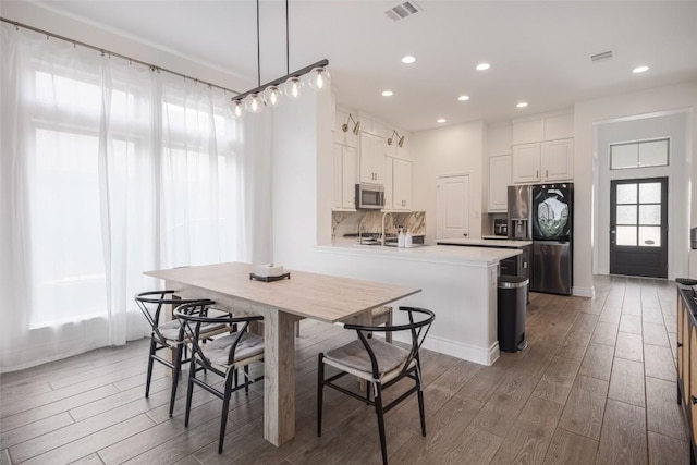 dining area featuring hardwood / wood-style floors