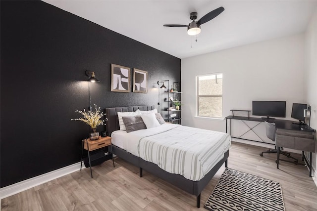 bedroom featuring ceiling fan and wood-type flooring