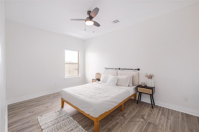 bedroom featuring ceiling fan and light hardwood / wood-style flooring