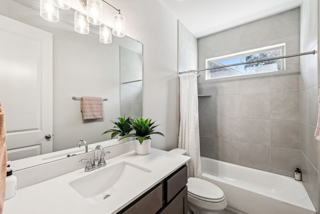 full bathroom with toilet, vanity, and shower / bathtub combination with curtain