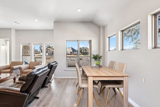 dining area with light hardwood / wood-style flooring