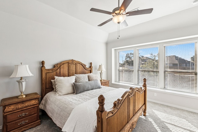 bedroom featuring vaulted ceiling, ceiling fan, and carpet