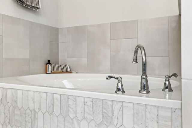 bathroom featuring tiled bath