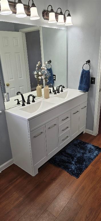 bathroom featuring vanity and hardwood / wood-style floors