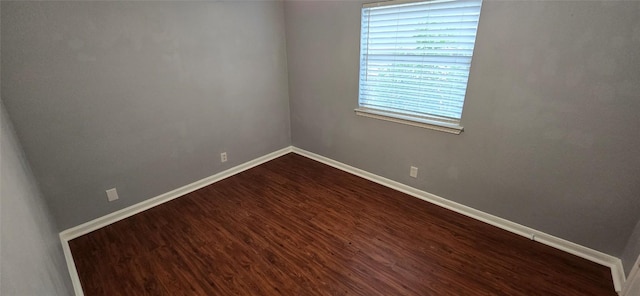 unfurnished room with hardwood / wood-style floors